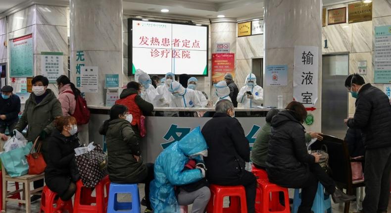 Medical facilities in the Chinese city of Wuhan are swamped with patients waiting for hours to see doctors