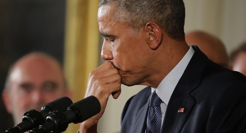 U.S. President Barack Obama pauses as he talks about the victims of the 2012 Sandy Hook Elementary School shooting and about his efforts to increase federal gun control in the East Room of the White House January 5, 2016 in Washington, DC.