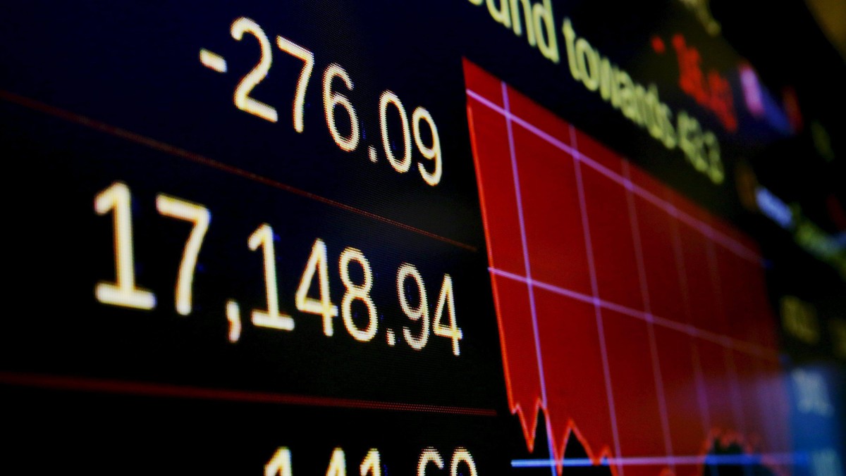 The day's numbers are shown on a screen above the floor of the New York Stock Exchange (NYSE) shortl