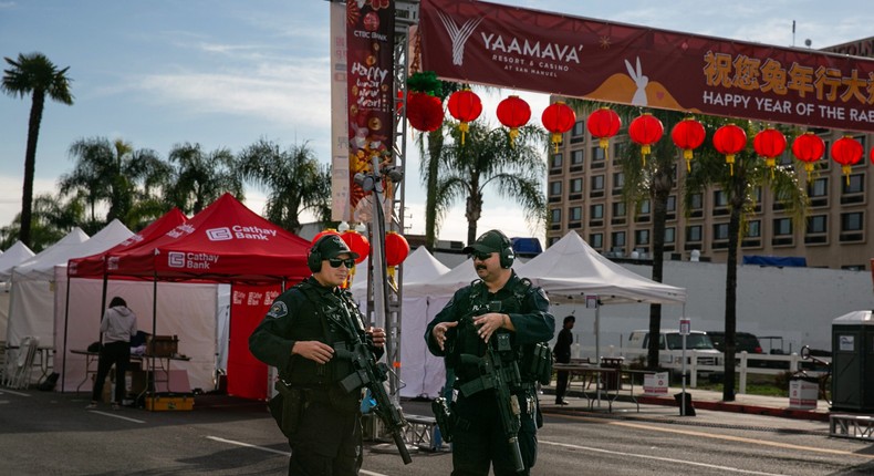 Officials secure and investigate the scene where a man opened fire at a ballroom dance studio in Monterey Park in Monterey Park in Monterey Park, CA.Jason Armond / Los Angeles Times via Getty Images