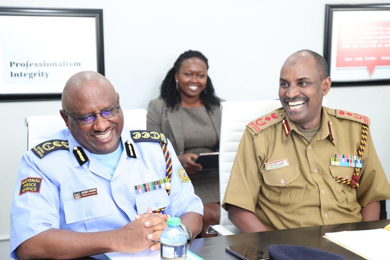 Police IG Japheth Koome and APS Deputy Inspector General Noor Gabow meet at the Supreme Court building on February 13, 2023.