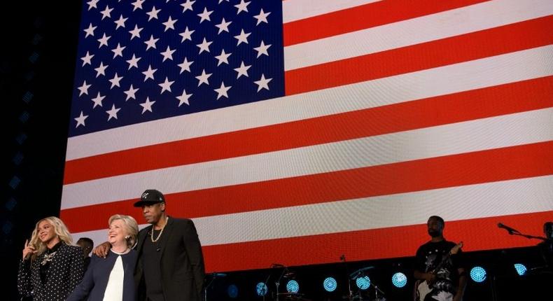 Music superstars such as Bruce Springsteen, Lady Gaga, Jon Bon Jovi and Beyonce (L) and Jay Z (R) are standing behind Democratic presidential nominee Hillary Clinton (C) in the final days of the US campaign