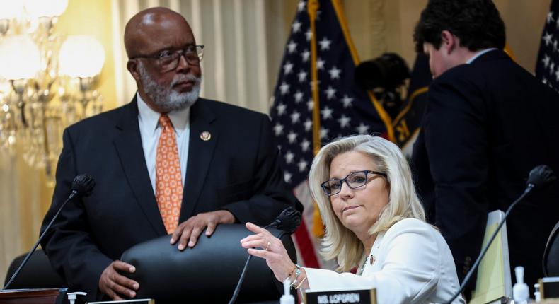 Rep. Liz Cheney, vice chair of the House Select Committee to Investigate the January 6th Attack on the US Capitol, and Committee Chair Bennie Thomson take their seats during the panel's fifth hearing on Thursday.