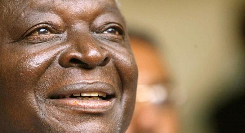 FILE - The late Mwai Kibaki smiles during a press conference 29 December 2002 in Nairobi after the chairman of the country's electoral commission announced Kibaki was the new president of Kenya. (Photo by ALEXANDER JOE/AFP via Getty Images)