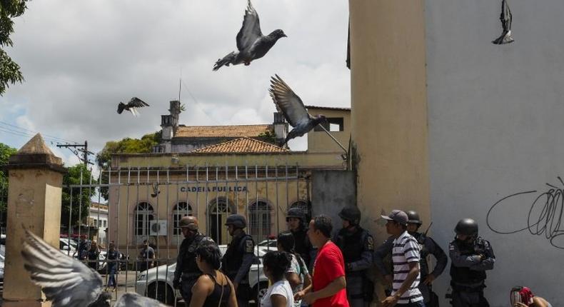 Relatives of inmates gather at the entrance of the Desembargador Raimundo Vidal Pessoa public jail in Manaus, Amazonas State, Brazil, on January 8, 2017 after at least four inmates were killed during a rebellion