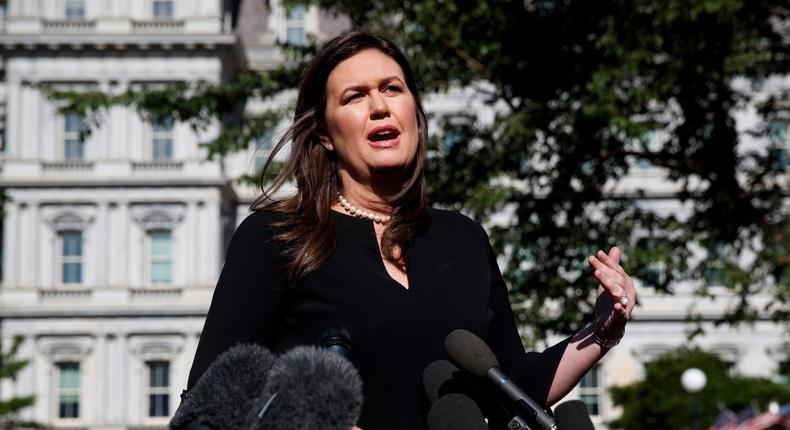 White House press secretary Sarah Sanders talks with reporters outside the White House, Tuesday, June 11, 2019, in Washington. (AP Photo/Evan Vucci)