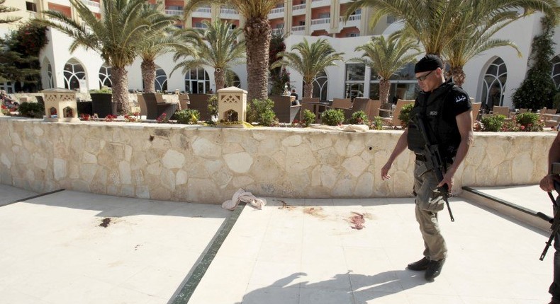 A police officer walks past blood at the Imperiale Marhaba hotel after a gunman opened fire at the beachside hotel in Sousse, Tunisia June 26, 2015.   REUTERS/Zoubeir Souissi