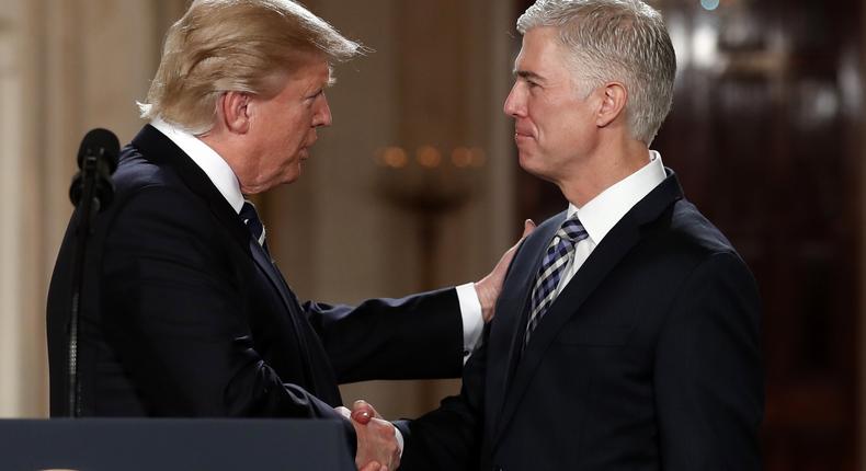 President Donald Trump shakes hands with Neil Gorsuch, his choice for Supreme Court justice on Jan. 31, 2017.