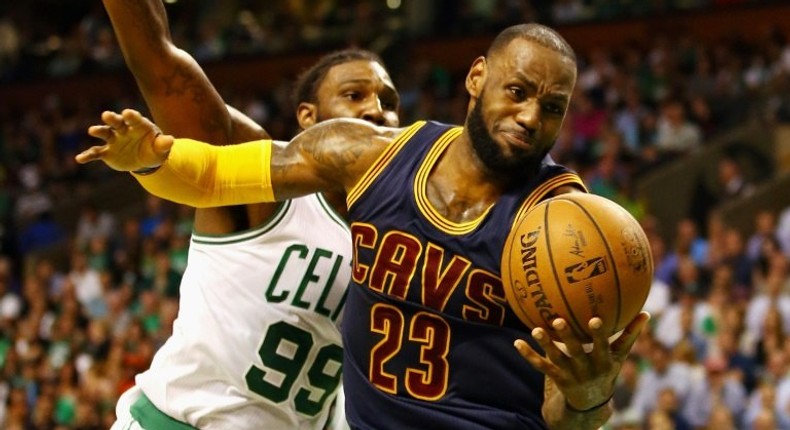 LeBron James of the Cleveland Cavaliers battles for the ball with Jae Crowder of the Boston Celtics in Game Two of the 2017 NBA Eastern Conference finals, at TD Garden in Boston, Massachusetts, on May 19