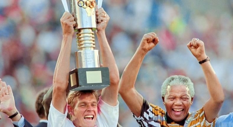 Neil Tovey celebrates with Nelson Mandela in 1996 after South Africa won the Africa Nations Cup