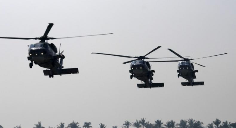 Taiwanese military helicopters fly in formation during a drill in Kaohsiung in January 2017