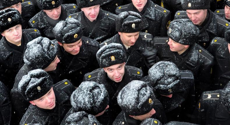 Russian sailors at a farewell ceremony for the departure of the nuclear-powered cruiser Peter the Great to at-sea military exercises, in the town of Severomorsk, March 30, 2010.