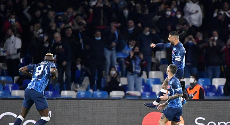 Jumping for joy: team-mates rush to congratulate a leaping  Lorenzo after his 11th Napoli goal gave them the lead against Inter Creator: Alberto PIZZOLI