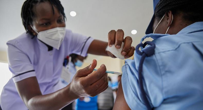 Woman getting vaccinated in Kenya