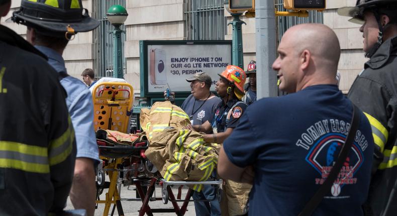 Emergency service personnel work at the scene of a subway train derailment, Tuesday, June 27, 2017, in the Harlem neighborhood of New York.