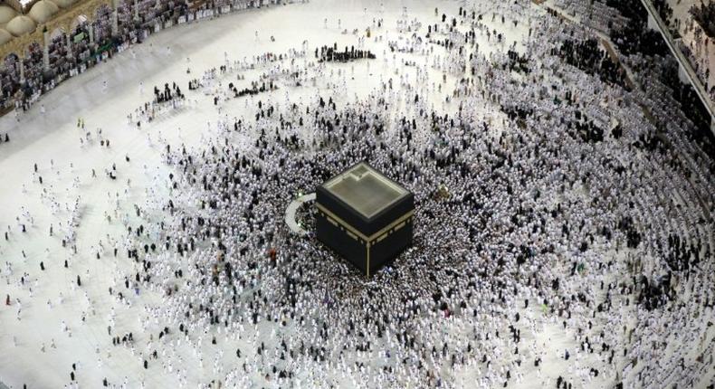 Muslim worshippers pray at the Kaaba, Islam's holiest shrine, at the Grand Mosque in Saudi Arabia's holy city of Mecca on June 23, 2017, during the last Friday of the holy month of Ramadan