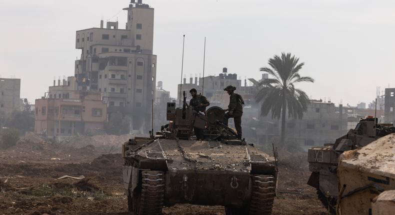 This picture taken during a media tour organized by the Israeli military on Jan. 8, 2024, shows troops operating in the area of al-Bureij in the central Gaza Strip.Photo by MENAHEM KAHANA/AFP via Getty Images