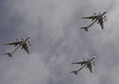 Tupolev Tu-95MS Bear strategic bombers fly in formation over the Red Square during the Victory Day parade in Moscow