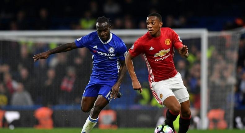 Manchester United's striker Anthony Martial (R) takes on Chelsea's midfielder Victor Moses (L) during the English Premier League football match October 23, 2016