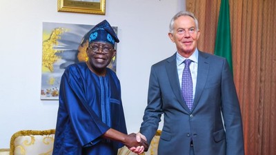Tinubu and Blair in a warm ahnd shake