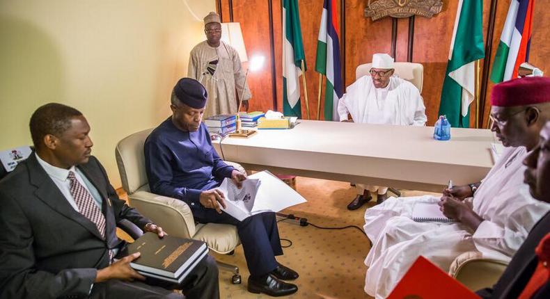 Members of the Presidential Investigation Panel presenting the report of their investigation to President Muhammadu Buhari in Abuja