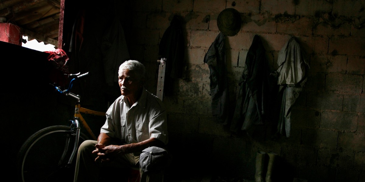 A man rests after a day's work in the expropriated Fundo Aracal in the state of Yaracuy.