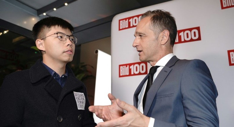 Beijing reacted angrily to the meeting between Hong Kong pro-democracy activist Joshua Wong (L) and German Foreign Minister Heiko Maas