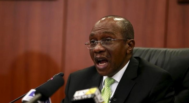 Governor Godwin Emefiele announces that Nigeria's central bank is keeping its benchmark interest rate on hold at 13 percent in Abuja, Nigeria, July 24, 2015. REUTERS/Afolabi Sotunde