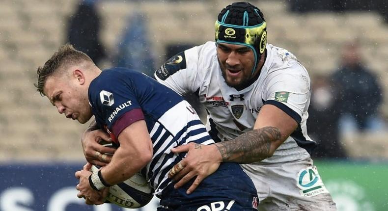 Bordeaux-Begles flyhalf Ian Madigan (left) is tackled by Clermont lock Sebastien Vahaamahina during their European Champions Cup clash in Bordeaux on January 15, 2017