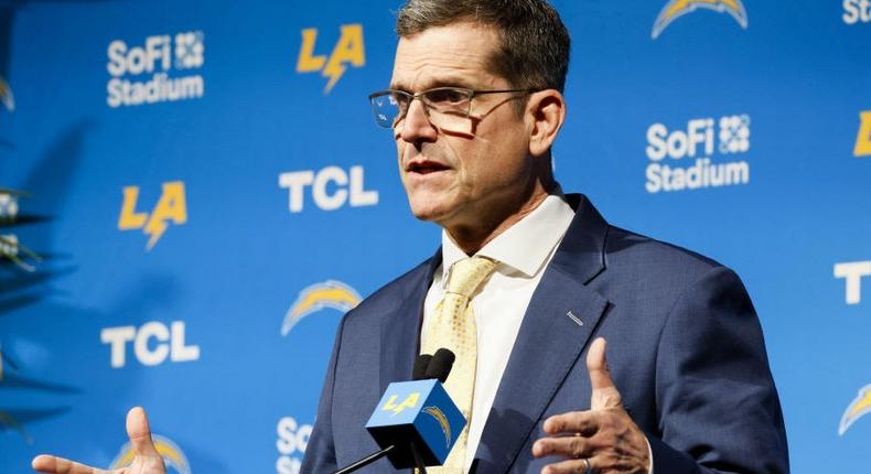 Jim Harbaugh's new contract with the Chargers will pay him more than his brother and all but one NFL coach. Allen J. Schaben / Los Angeles Times via Getty Images
