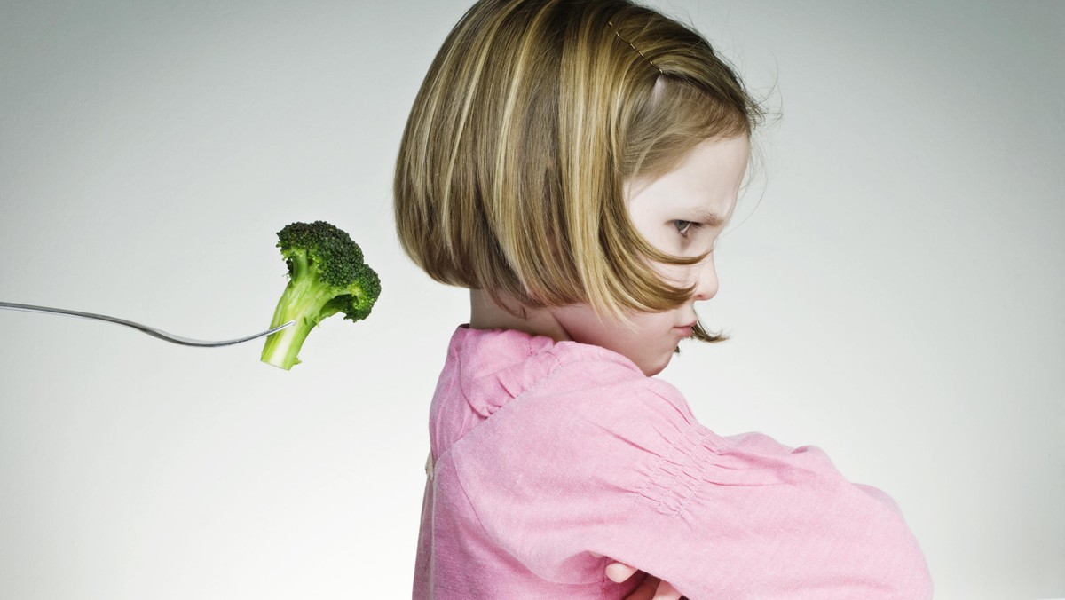 Young Girl Refusing To Eat Her Greens