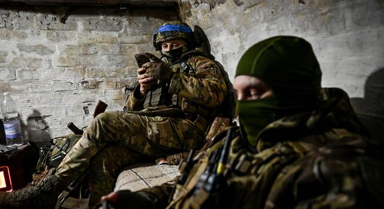 A member of a police unit of FPV pilots looks at a smartphone in Zaporizhzhia region, southeastern Ukraine.Dmytro Smolienko / Ukrinform/Future Publishing via Getty Images