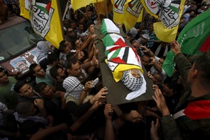 Mourners carry the body of 13-year-old Palestinian boy Abdel-Rahman Abeidallah, who was shot by Isra