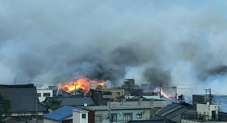 Flames and smoke engulf homes in Itoigawa city, Niigata prefecture on December 22, 2016