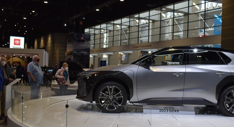 People viewing a prototype of Toyota's bZ4X.