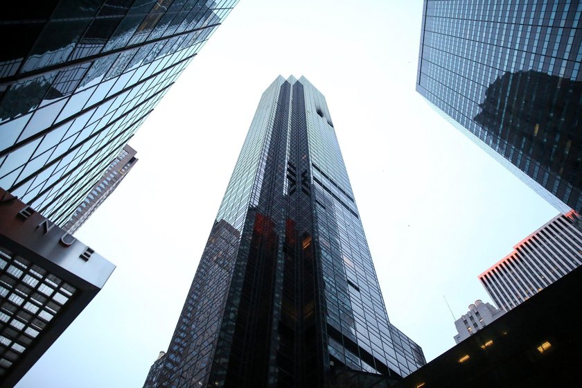 Damaged windows are seen after a fire in a residential unit at Trump Tower in New York