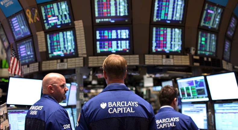 Traders work on the floor of the New York Stock Exchange moments before the closing bell on April 5, 2010 in New York, New York
