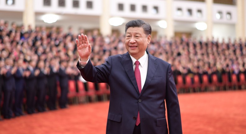 Chinese President Xi Jinping, also general secretary of the Communist Party of China CPC Central Committee and chairman of the Central Military Commission, waves while meeting with awardees of the titles of outstanding Party members, exemplary Party workers, and advanced community-level Party organizations from across the country before the ceremony to present the July 1 Medal, the Party's highest honor, to outstanding Party members at the Great Hall of the People in Beijing, capital of China, June 29, 2021. The award ceremony of the July 1 Medal was held Tuesday morning at the Great Hall of the People in Beijing.