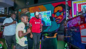 MC Lotan Salapei(left), radio presenter Fred Arocho(center) and MC Eric Njiru analyzing the predictions on screen during the Guinness brightest matchday madeby the fans at Bar Next Door, Kiambu Road