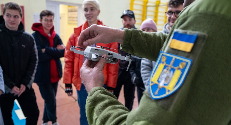 A group of civilian participants listen to an instructor during a drone pilot training in Lviv, Ukraine.Stanislav Ivanov/Global Images Ukraine via Getty Images