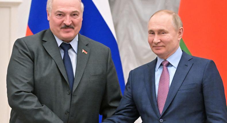 Russian President Vladimir Putin shakes hands with his Belarusian counterpart Alexander Lukashenko during a press conference in Moscow.
