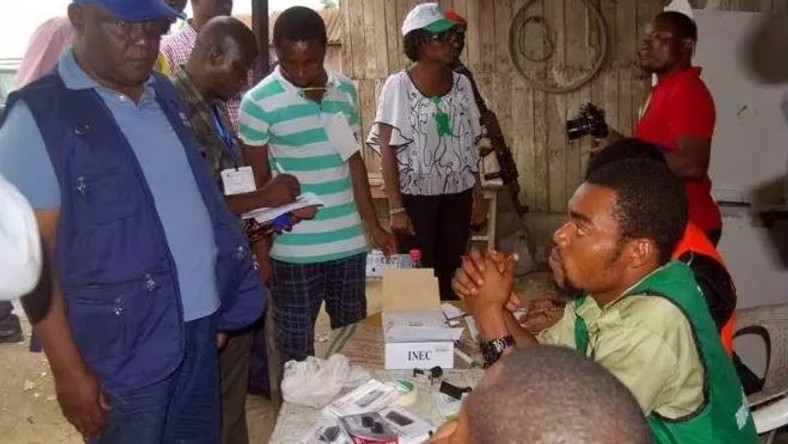 INEC staff during an election [Punch]