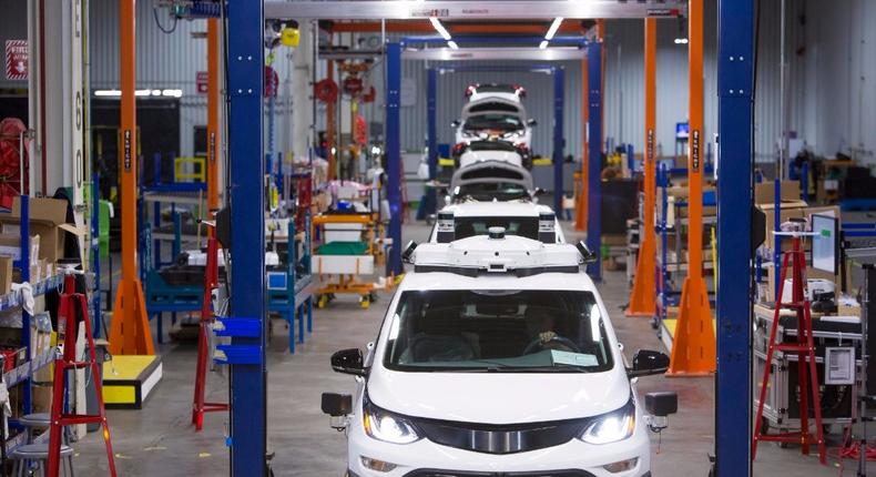 Self-driving Chevy Bolt's being assembled at a GM plant.