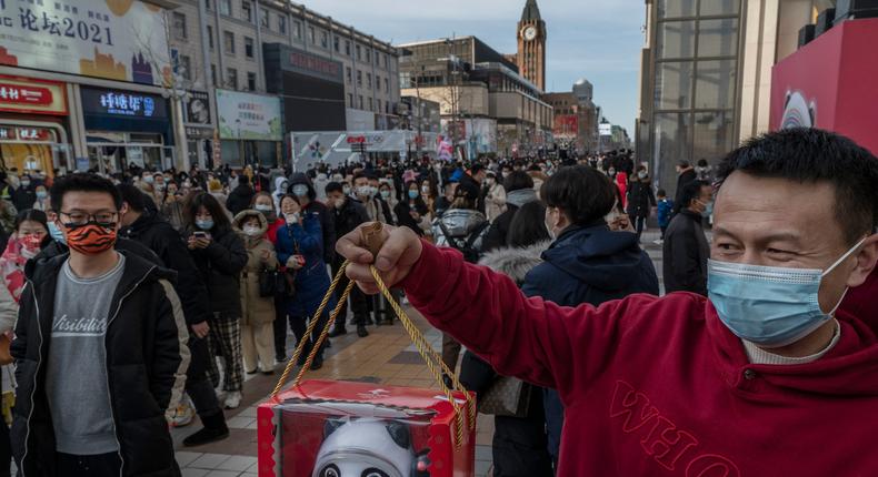 The panda mascot for the Beijing Winter Olympics is a big hit in China where people are queueing for hours to snag merch featuring the chubby bear.