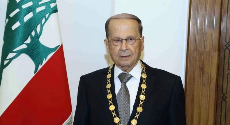 Lebanese President Michel Aoun posing with the presidential medal at the presidential palace of Baabda, east of Beirut on October 31, 2016