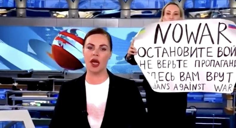 A still of a broadcast from Russia's Channel 1 TV network showing Maria Ovsyannikova holding a banner on March 14, 2022.