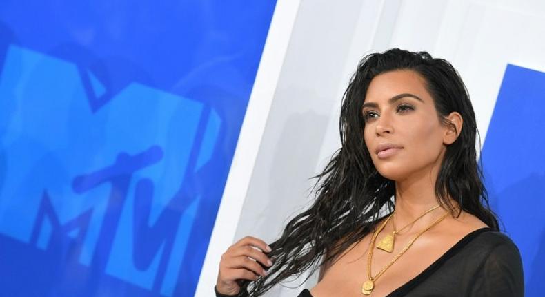 French police say a gang of five armed men on October 3, tied up Kim Kardashian in a luxury apartment in Paris and stole a ring and jewellery worth around nine million euros