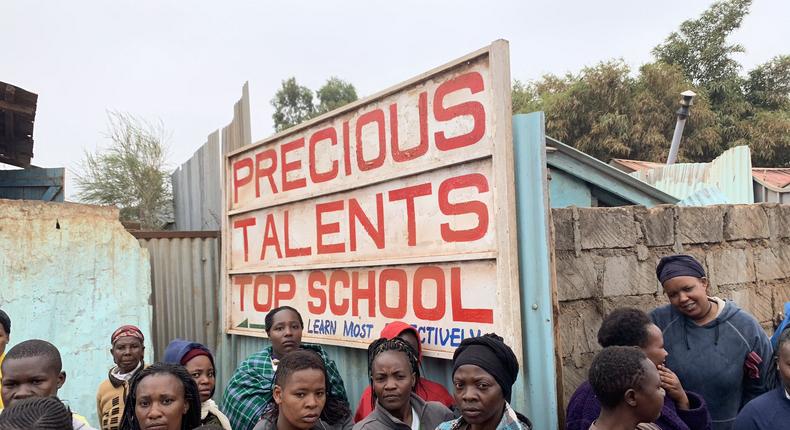 Onlookers on-site at Precious Talents School where 4 pupils were feared dead on Monday morning after building collapsed