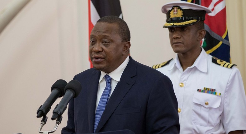 File image of President Uhuru Kenyatta and his  Aide-de-Camp Lieutenant Colonel Timothy Stelu Lekolool at State House Nairobi