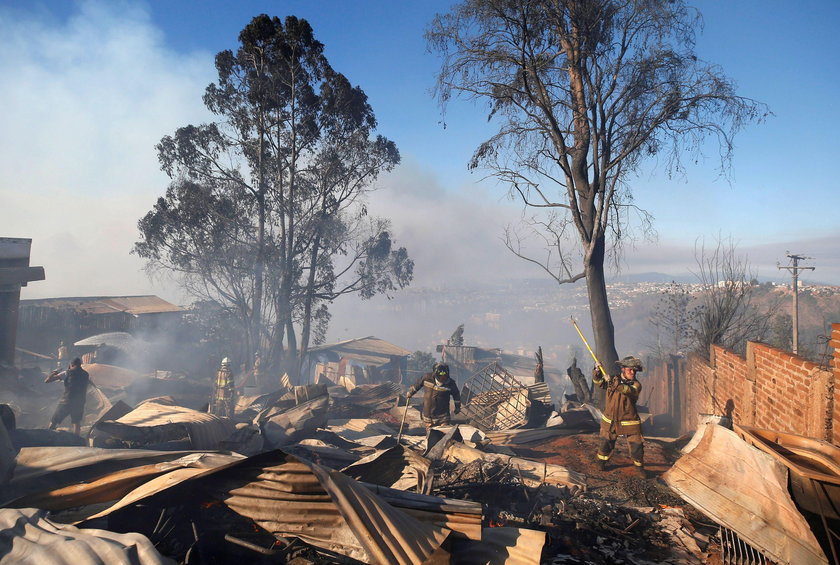 A house burns following the spread of wildfires in Valparaiso